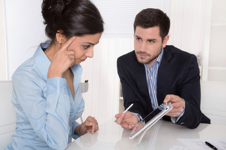 Consultation between businessman and customer at office.